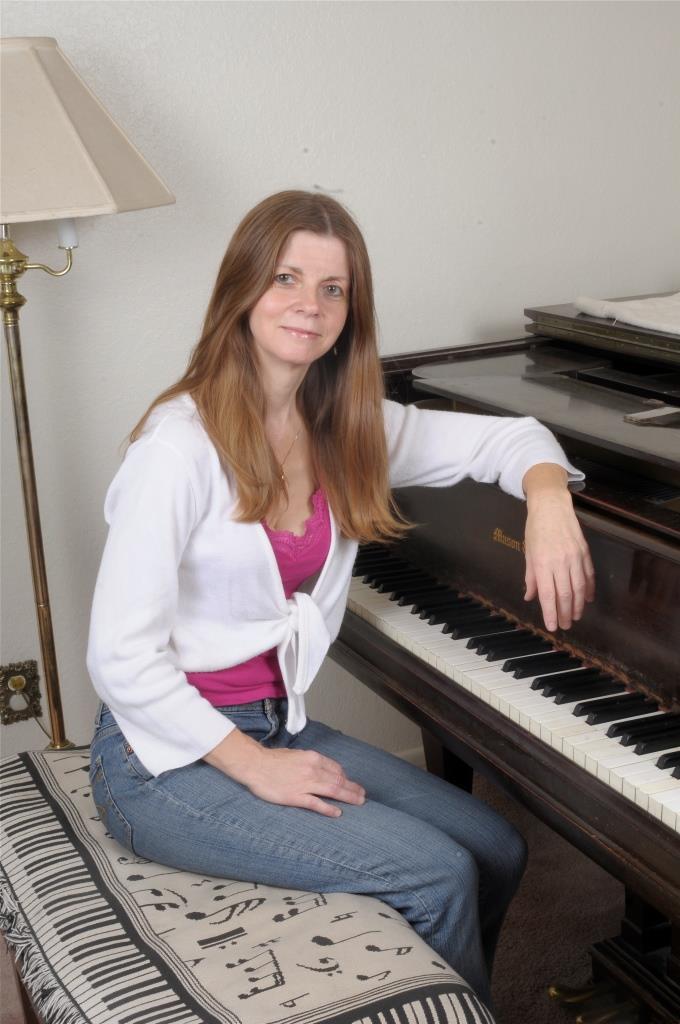 Daniela Clapp, the Vegan Mom, playing the piano